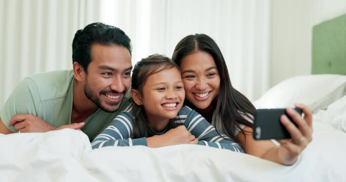 Father, mother and child for a selfie in bed at a family home for happiness, quality time and memory. A happy man, woman and girl kid in a bedroom together for a profile picture with love and care
