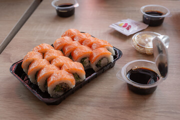 salmon roll set on the table in sushi restaurant in kharkiv city