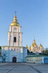 Fototapeta na wymiar bell tower of St. Mihail Golden Dome Monastery in the evening in capital kyiv