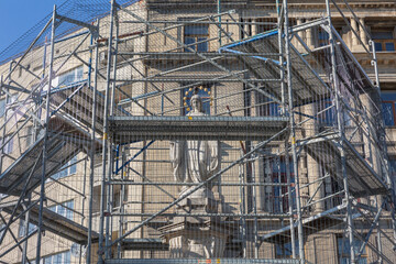 religious historical statue covered with iron frames for protection in lviv old city