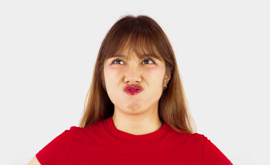 Young asian woman long hair style in red t shirt posing moody face emotional isolated on white background