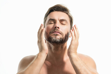 Obraz premium Sexy shirtless man close up portrait care of skin, isolated over white background. Charming man with perfect smooth soft skin. Spa therapy. Man, face, beauty and skincare concept.