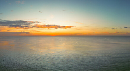 Fototapeta premium .aerial panorama beautiful sunset at Surin beach Phuket..amazing colorful cloud in beautiful sky at sunset..Scene of Colorful romantic sky sunset with cloud in the sky background..
