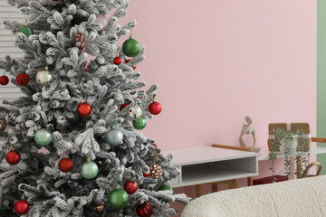 Stylish interior of living room with decorated Christmas tree