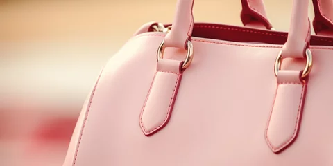 Fotobehang Close-up of elegant pink designer handbag with high quality leather © Maris
