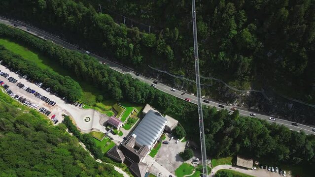 Aerial view of people walking over Highland 179 pedestrian suspension bridge near Ehrenberg castle, Reutte, Germany