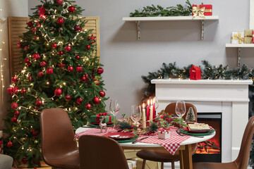 Beautiful interior of room with table setting decorated for Christmas