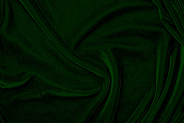 green velvet fabric texture used as background. Emerald color panne fabric background of soft and...