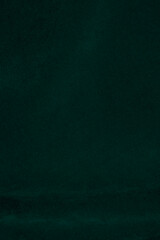 Dark green velvet fabric texture used as background. Emerald color panne fabric background of soft...