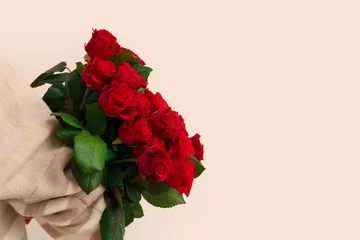Gordijnen Young woman with bouquet of beautiful red roses on white background. Valentine's day celebration © Pixel-Shot