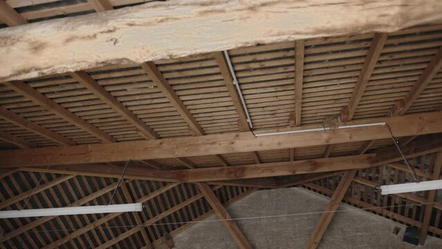 interior shot of a barn wooden roof construction 