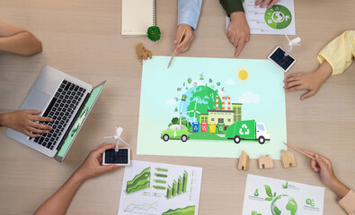 Eco city and waste management illustration placed on a meeting table during a green business...