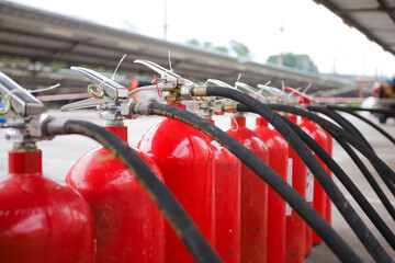 Red tank of fire extinguisher Overview of a powerful industrial fire extinguishing system. ready...
