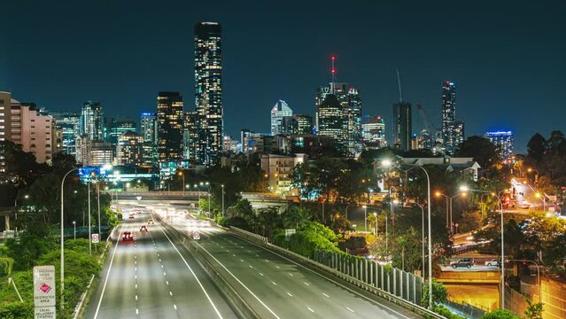 Time lapse Footage of Brisbane cityscape with expressway traffic road at the evening time after working hour, Queensland, Australia, business finance and industry and Transportation concept