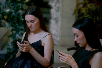 Customer play smart phone at night club.