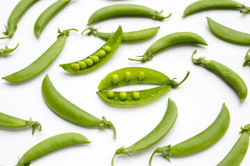 Fresh young green peas on white background.