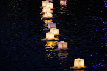 water lanterns float on the calm lake