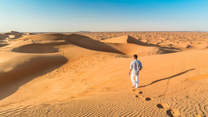 Dubai desert sand dunes, men on Dubai desert safari, United Arab Emirates vacation, men on vacation...