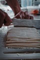 Chopping homemade Udon noodle