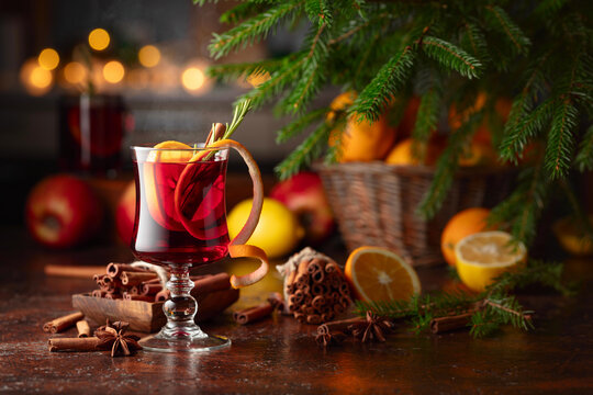 Christmas mulled wine with citrus, apples, cinnamon, anise, and rosemary.