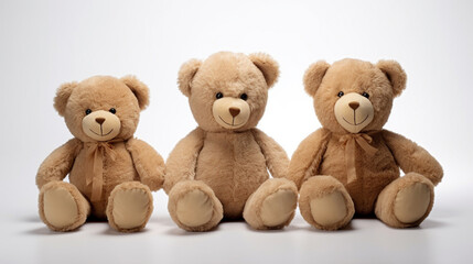 A set of three teddy bears on a white background