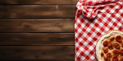 Obraz premium Vintage wooden background with red and white textile, providing copy space for text, displays cooking food, particularly pizza, on a wooden table.