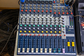 mixing console with multi-colored controls and sliders