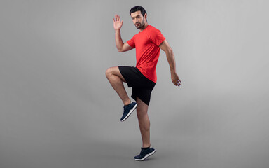 Full body length gaiety shot athletic and sporty young man fitness running cardio exercise posture...