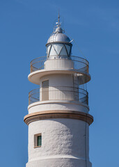 White lighthouse against a blue sky close-up. Port de Soller, Mallorca, Spain