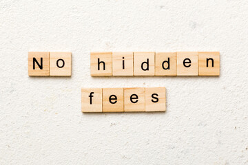 no hidden fees word written on wood block. no hidden fees text on table, concept