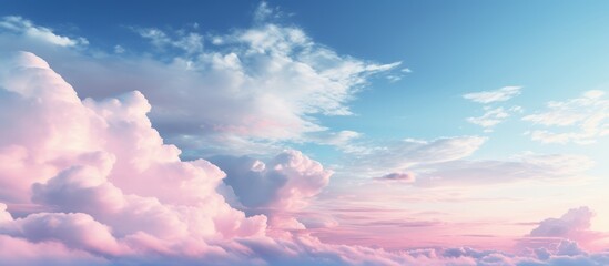 Photo from airplane Beautiful Clouds and evening light romantic blue sky with soft fluffy pink clouds. Panoramic natural view of a dreamy sky.