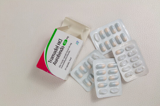 tramadol pain killer capsules in paper packaging for pain management and medical problems on white background