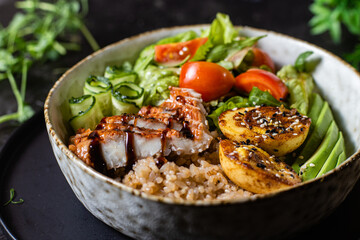 Breakfast in a plate. Poached egg with avocado and lettuce. 