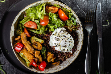 Breakfast in a plate. Poached egg with avocado and lettuce. 