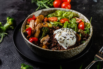 Breakfast in a plate. Poached egg with avocado and lettuce. 