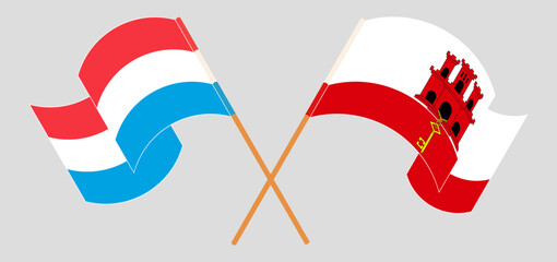 Crossed and waving flags of Luxembourg and Gibraltar