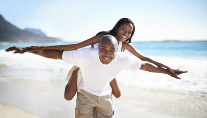 Black couple, smiling and piggyback with portrait, beach and married for summer vacation. African,...