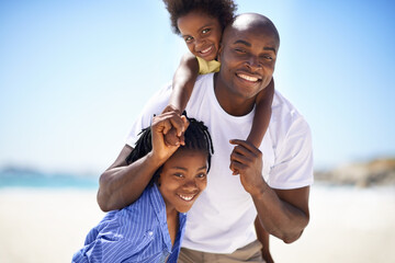 Portrait, piggyback and a black family on the beach in summer together for travel, freedom or...