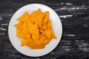 orange mexican nachos chips on plate