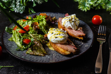 Toast with poached egg in a plate. Salad