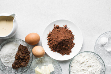 mise en place for making chocolate muffins, Flatlay of ingredients for making chocolate muffins, ingredients for making chocolate muffins