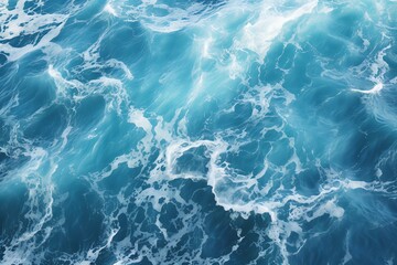 a blue water with white foam - obrazy, fototapety, plakaty
