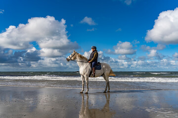 Horse rider on the beach at Anglesey 