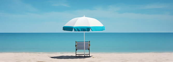 An umbrella and a lazy chair summer vacation getaway on the beach with blue sky background - obrazy, fototapety, plakaty