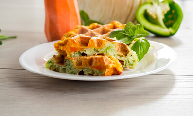 cooked two-color vegetable waffles made from cabbage and carrots.