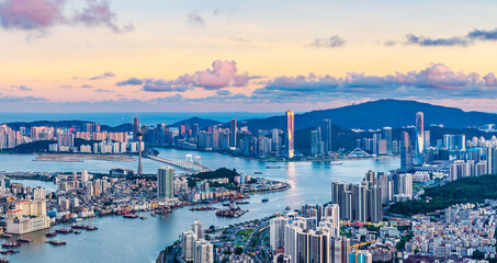 Aerial view of Zhuhai and Macau city skyline with modern buildings scenery at dusk by the sea....
