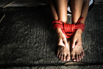 Stop the use of violence against young boys who are abused and locked up with their hands and feet bound. stop human trafficking - obrazy, fototapety, plakaty