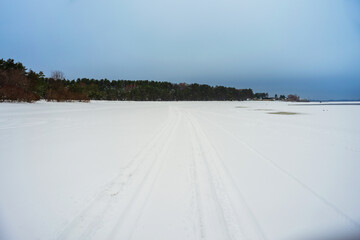 Snowy road in a winter field.