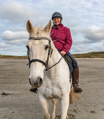 Horse riding on the beach on the Ilse of Anglesey