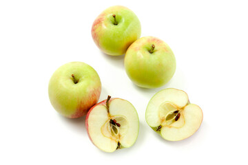 Half and whole of green apples isolated on white background with clipping path..
